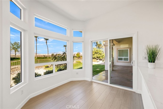 unfurnished sunroom featuring plenty of natural light