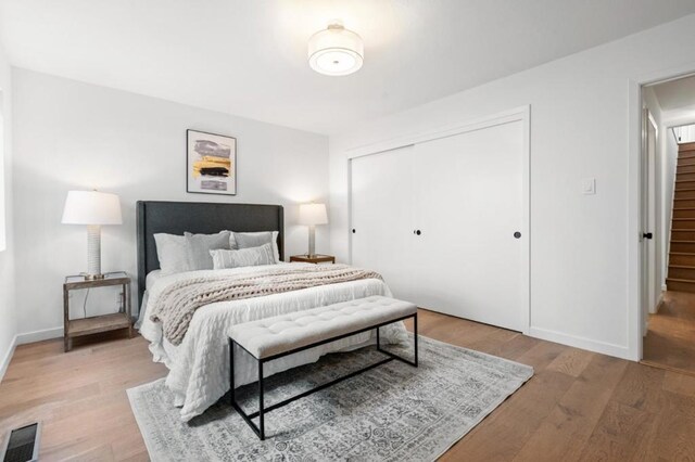 bedroom featuring a closet and light hardwood / wood-style floors