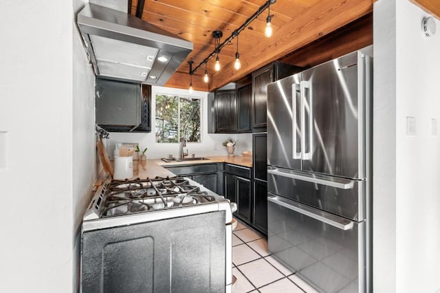 kitchen featuring wood ceiling, stainless steel fridge, white range with gas cooktop, light tile patterned flooring, and sink