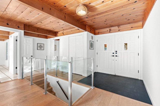 foyer featuring wooden ceiling, beam ceiling, and hardwood / wood-style flooring