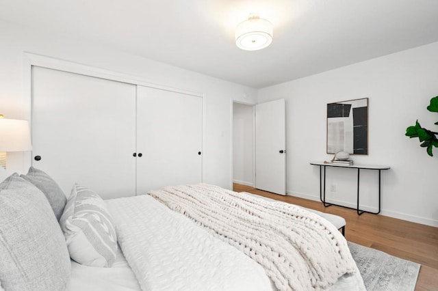 bedroom featuring a closet and light hardwood / wood-style flooring