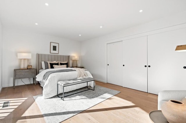 bedroom featuring a closet and light wood-type flooring