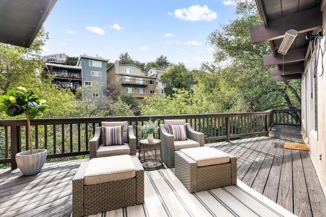 wooden terrace featuring an outdoor hangout area