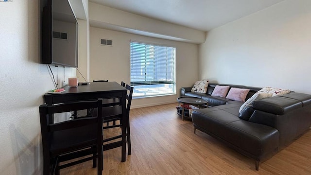 living room with light hardwood / wood-style floors