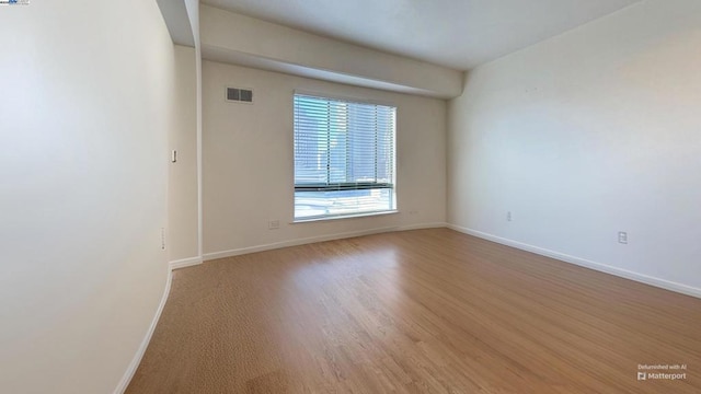 empty room featuring light hardwood / wood-style floors