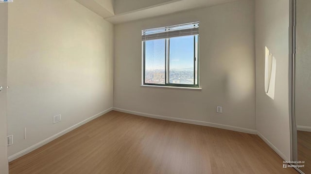 unfurnished room featuring light wood-type flooring