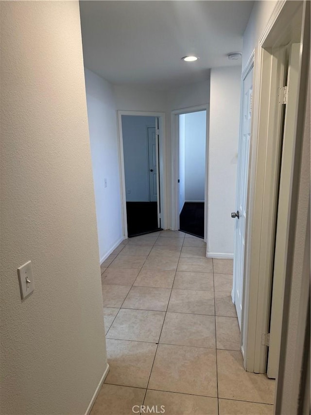 hallway with light tile patterned flooring