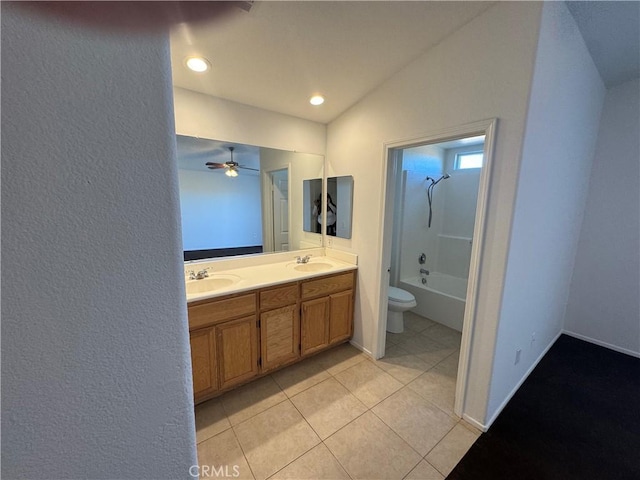 full bathroom with ceiling fan, vanity, tile patterned flooring, toilet, and lofted ceiling