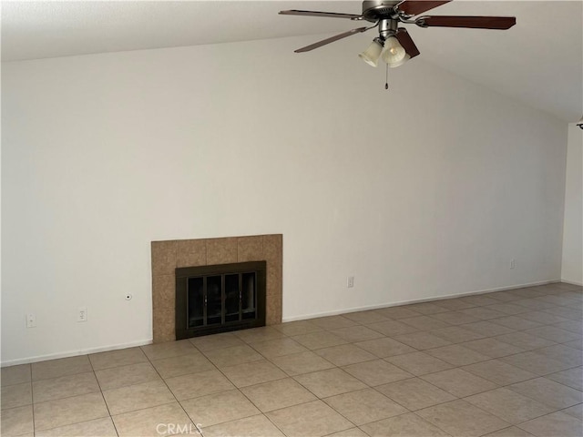 unfurnished living room featuring ceiling fan, light tile patterned floors, lofted ceiling, and a tiled fireplace