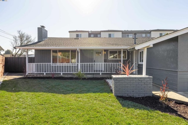 view of front of home with a front yard and a porch