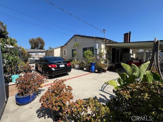 view of side of property with a patio area