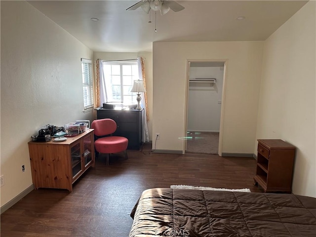 bedroom with dark hardwood / wood-style floors and ceiling fan