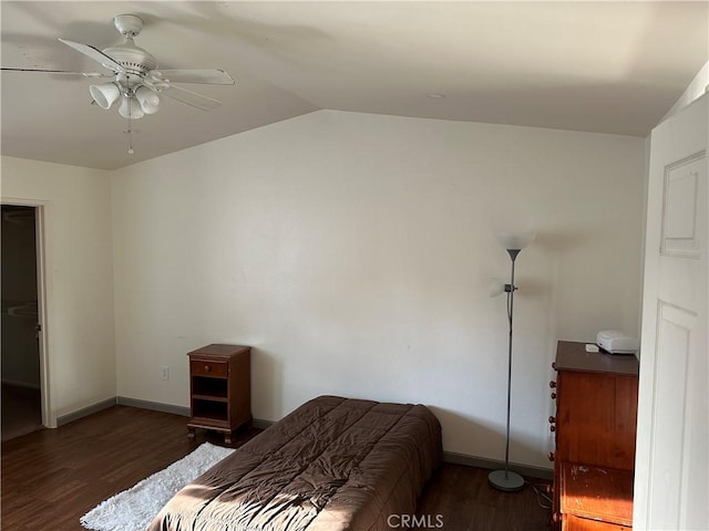 bedroom featuring ceiling fan, lofted ceiling, and dark wood-type flooring