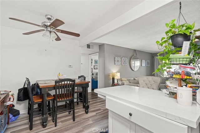 dining space featuring ceiling fan and light hardwood / wood-style floors