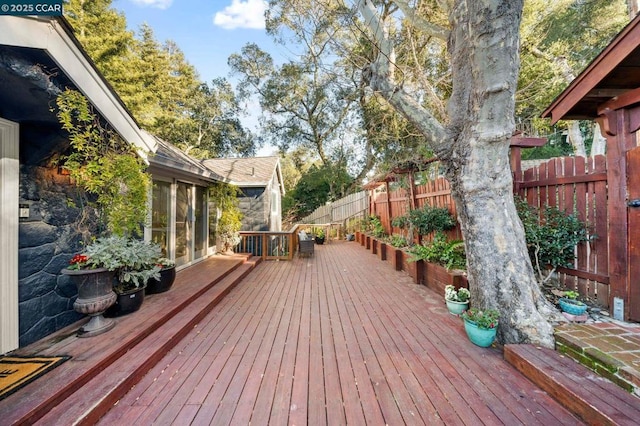 wooden terrace with a sunroom