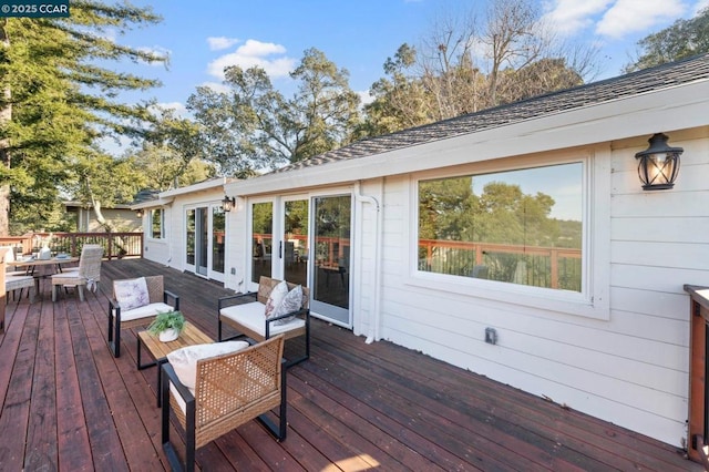 wooden deck featuring an outdoor hangout area