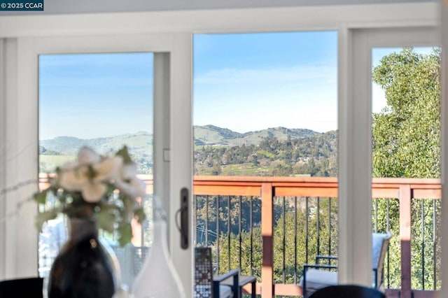 interior space with a mountain view and plenty of natural light