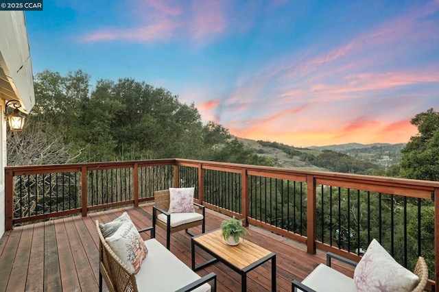 deck at dusk with a mountain view