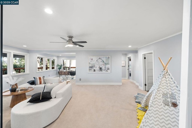 living room with light carpet, ceiling fan, and crown molding