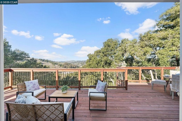 wooden deck featuring an outdoor hangout area