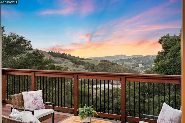 deck at dusk with a mountain view