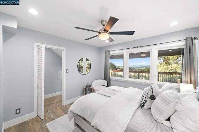 bedroom featuring ceiling fan and light hardwood / wood-style flooring