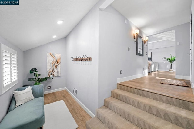 interior space with vaulted ceiling and hardwood / wood-style floors