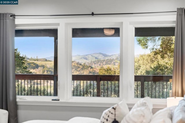 sunroom with a mountain view