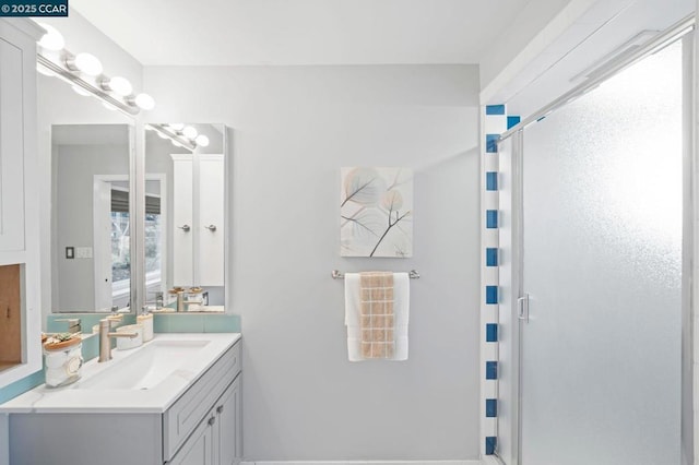 bathroom featuring vanity and walk in shower