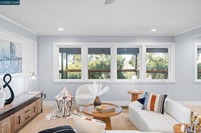 living room featuring a healthy amount of sunlight and ornamental molding