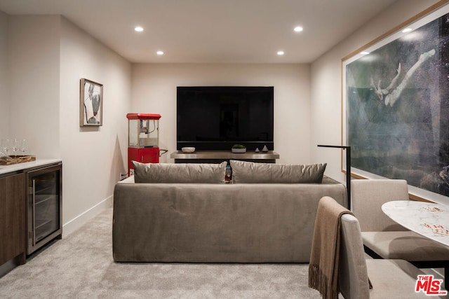 carpeted living room with bar and beverage cooler