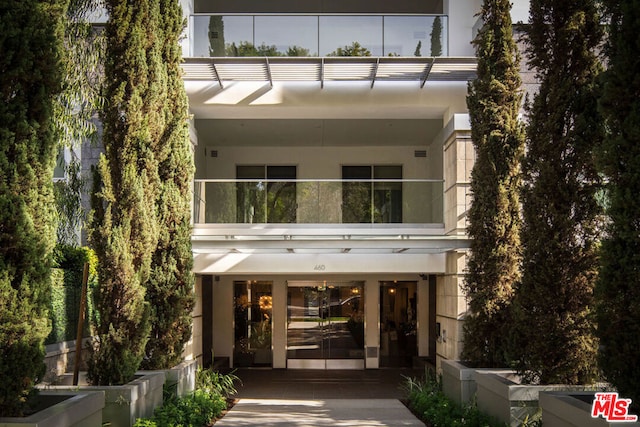 doorway to property featuring a balcony