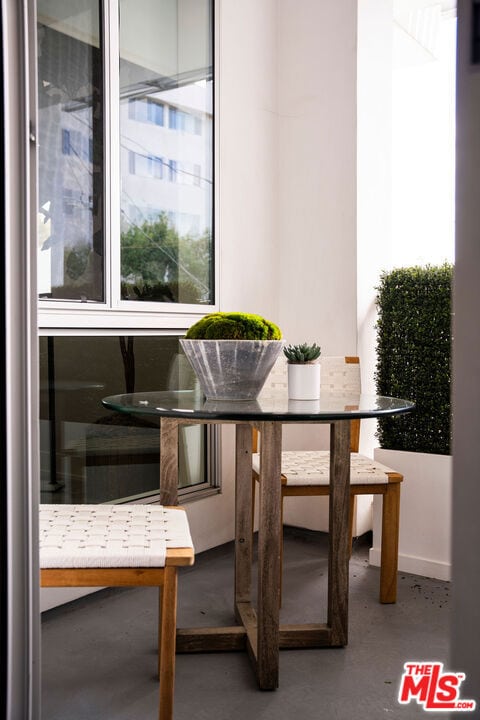 dining area with breakfast area and concrete flooring