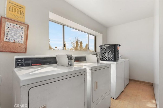 laundry room featuring separate washer and dryer