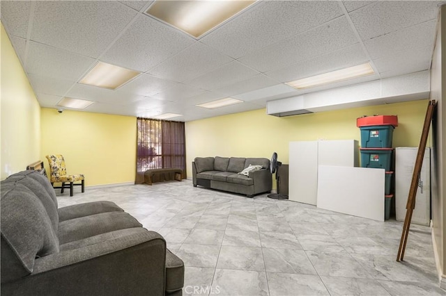 living room featuring a paneled ceiling