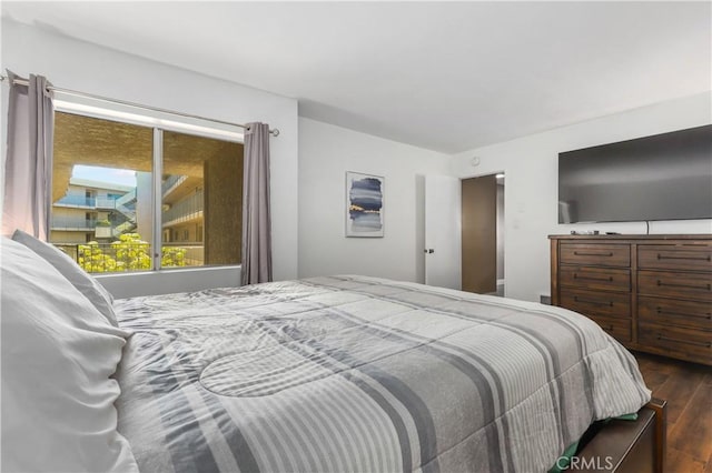 bedroom featuring dark hardwood / wood-style flooring