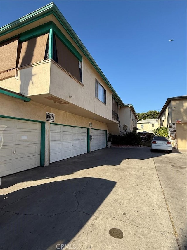 view of side of home featuring a garage