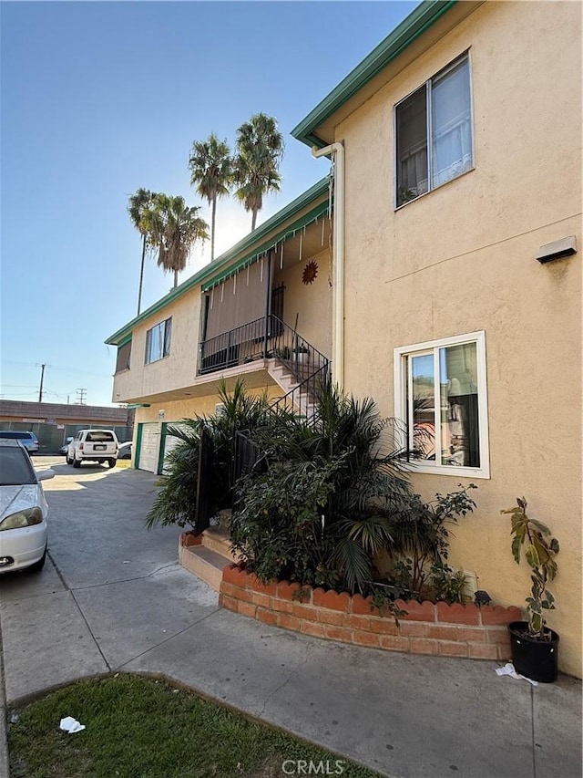 view of side of home with stucco siding