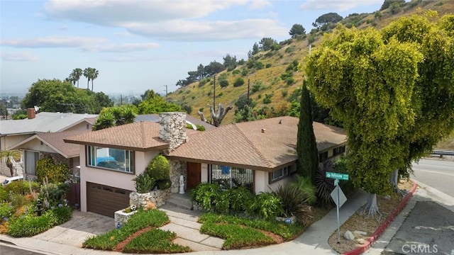 ranch-style home featuring a garage