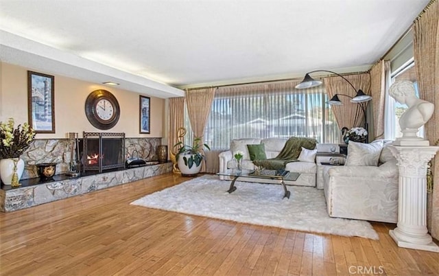 living room featuring a wealth of natural light and hardwood / wood-style floors