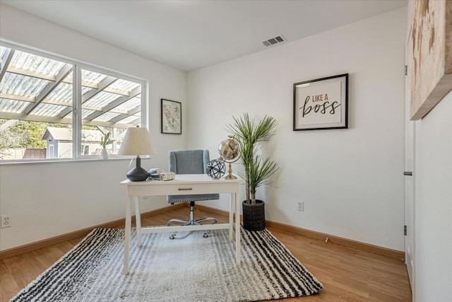 office space featuring light hardwood / wood-style floors