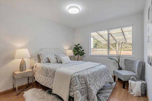 bedroom with hardwood / wood-style flooring