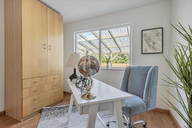 home office with light wood-type flooring