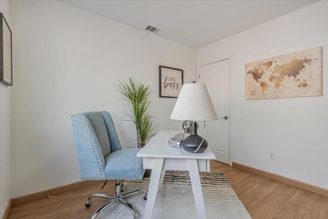 office area with light hardwood / wood-style flooring