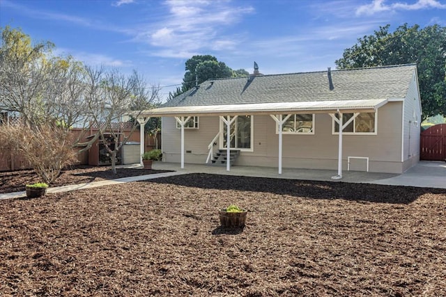 rear view of property featuring a patio