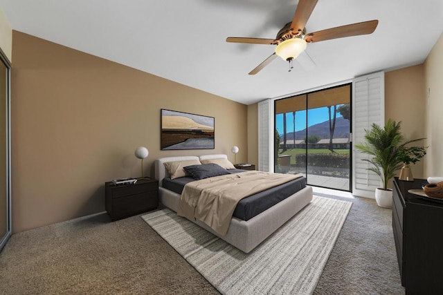 carpeted bedroom with ceiling fan, floor to ceiling windows, and access to outside