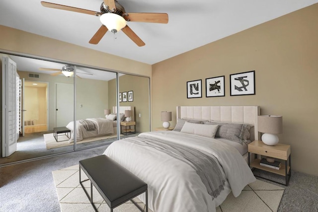 carpeted bedroom with ceiling fan and a closet