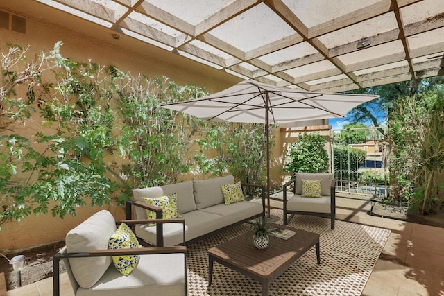 view of patio featuring a pergola and an outdoor living space