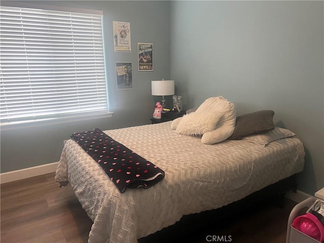 bedroom with hardwood / wood-style floors