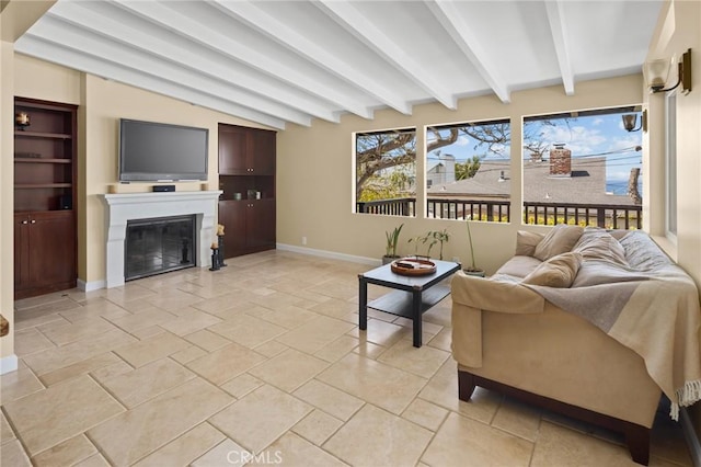 living room with vaulted ceiling with beams